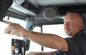 3rd Eye Truck Camera Systems user interacting with in-cab camera controls